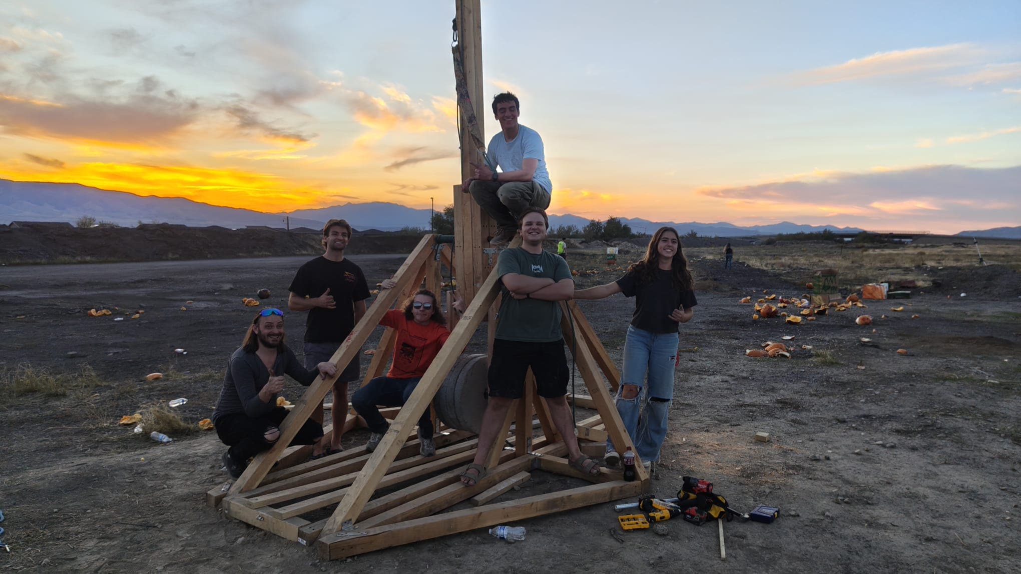 The team posing by our trebuchet after the successful event.