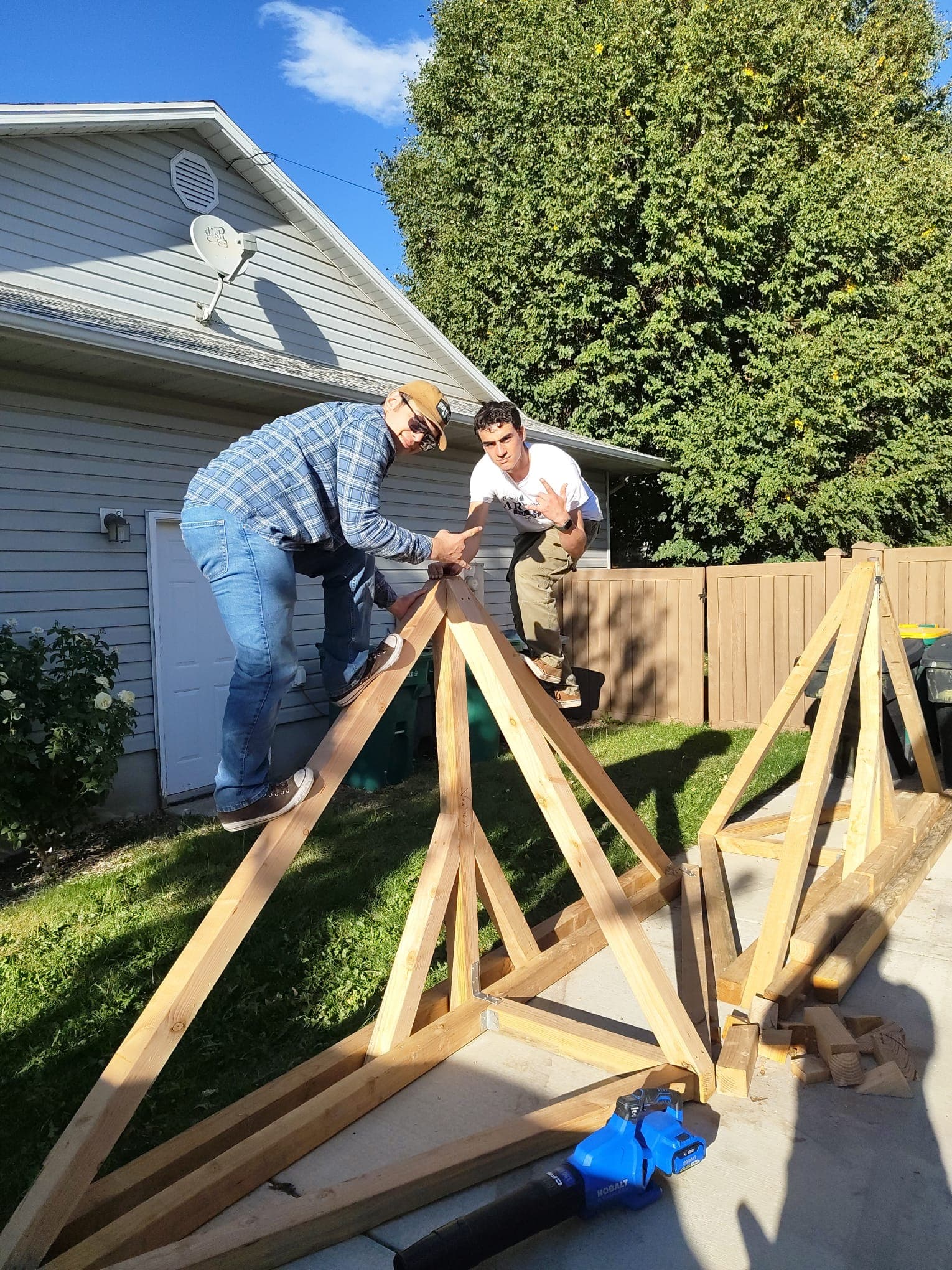 Isaac and Nathan testing out the freshly assembled trusses