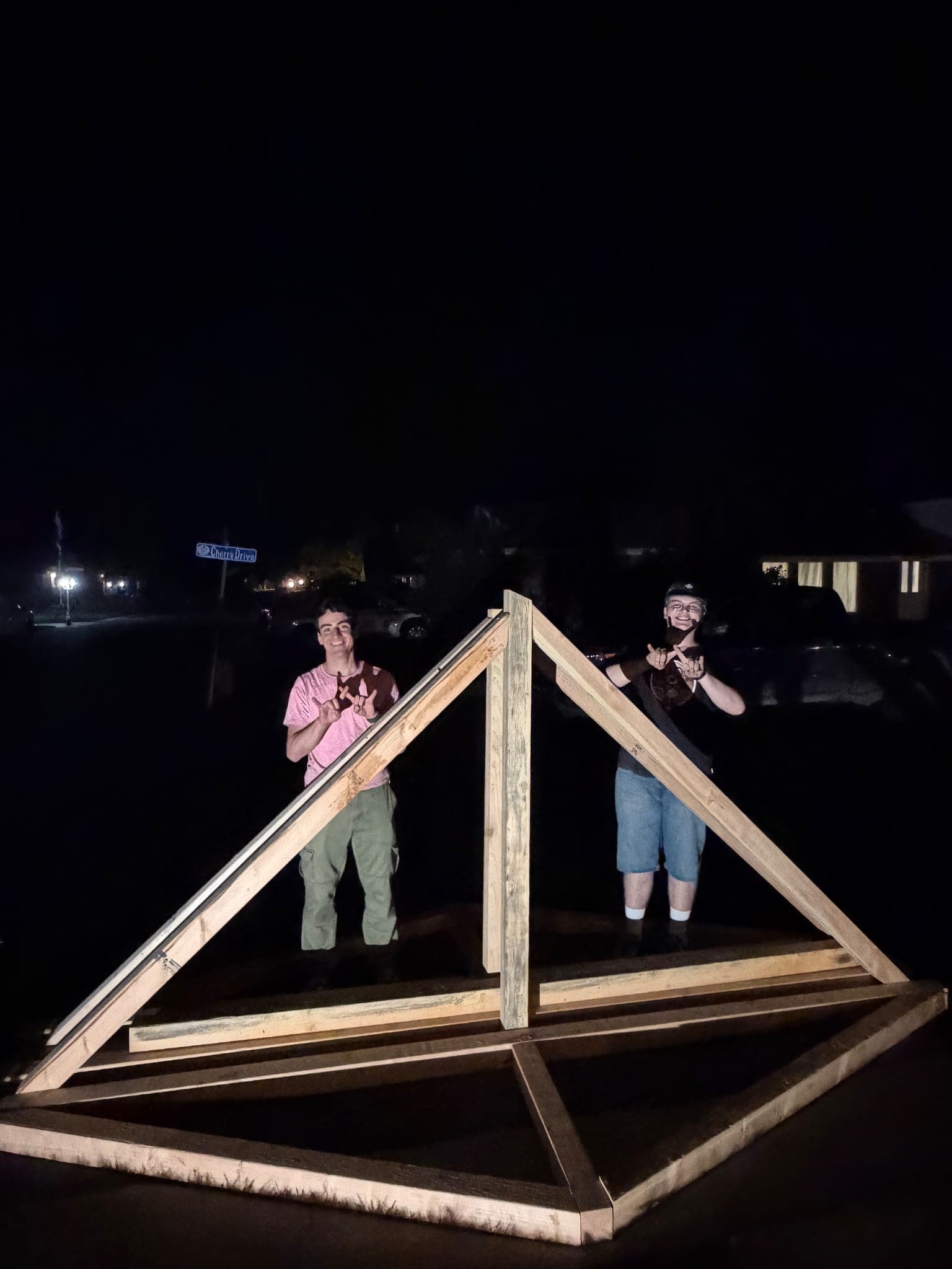 Isaac and I posing in front of our work after the first day (and night) of construction